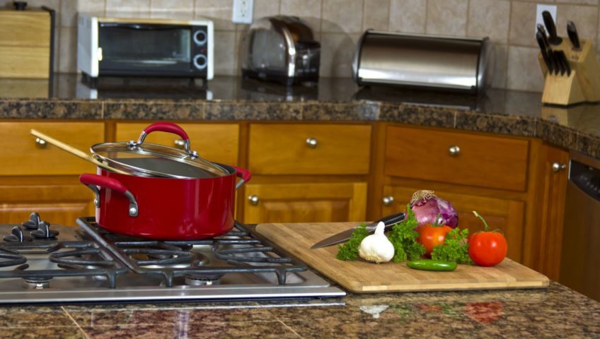 food on the counter waiting to be chopped and put in a pan